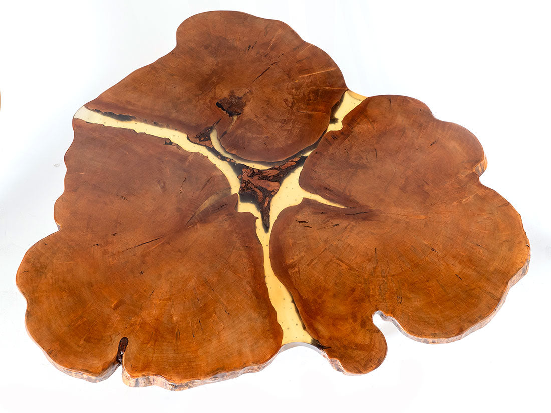 Enrico Bartolini 3-heart red Ambrosia maple table with starfruit-shaped legs, showcasing a unique and artistic wooden design.