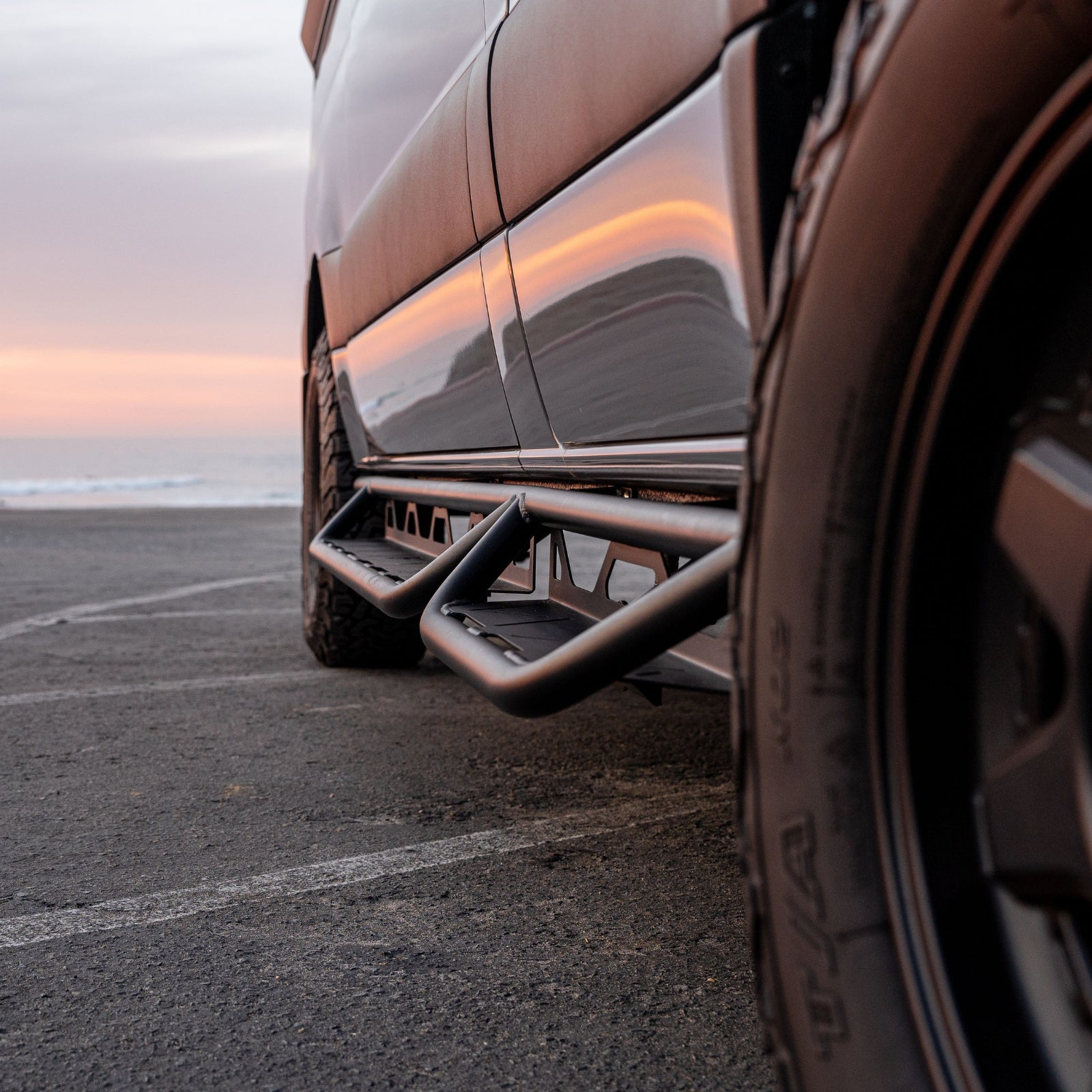 Vanspeed side steps for Sprinter van, showcasing durable design and easy access for passengers on the driver's side.