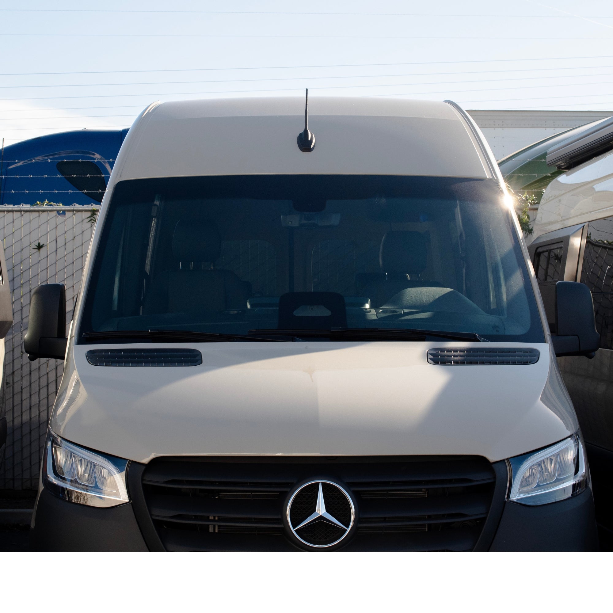 Sprinter short antenna by The Van Mart, compact black vehicle antenna for improved radio reception on van roofs.