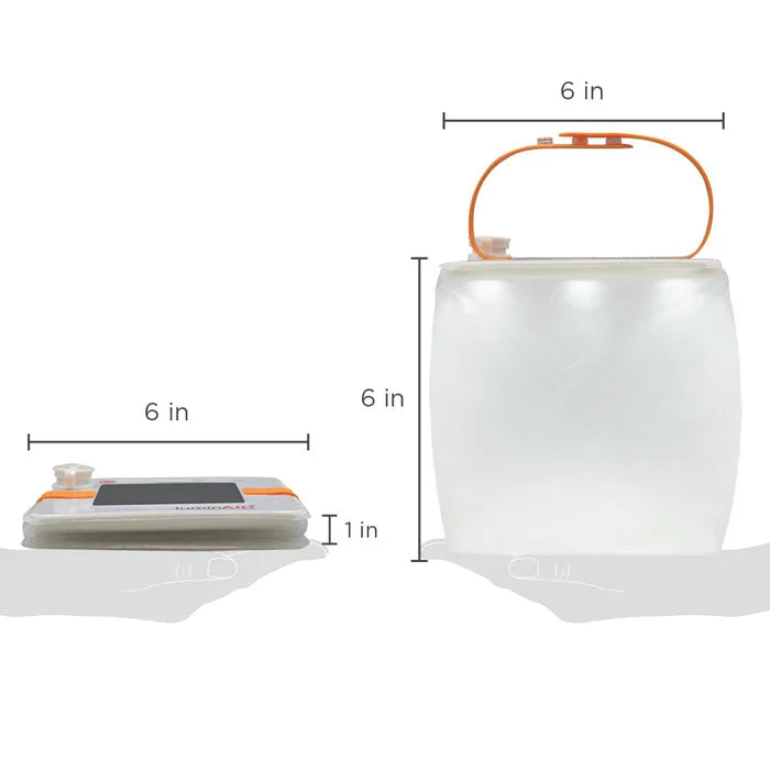 Alpenglow PackLite Max 2-in-1 Power Lantern outdoors, showcasing its bright light and portable design.