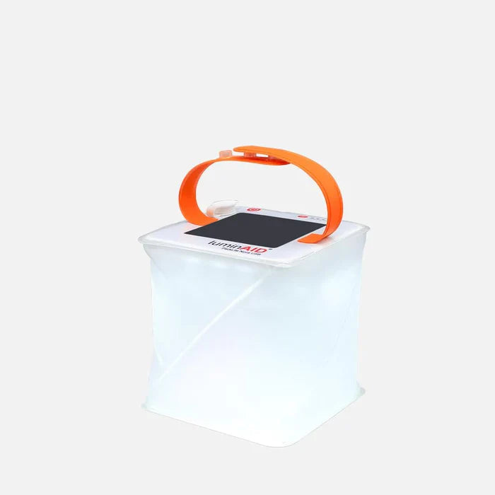 Alpenglow Readiness Supply outdoor solar lanterns glowing softly against a gray background, ideal for camping or backyard use.