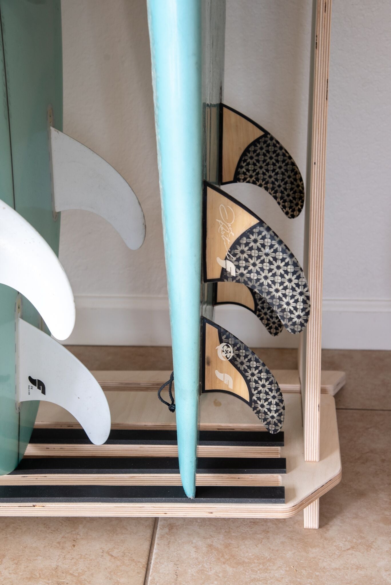Freestanding surfboard rack by Rado Racks, showcasing multiple boards in an outdoor setting.