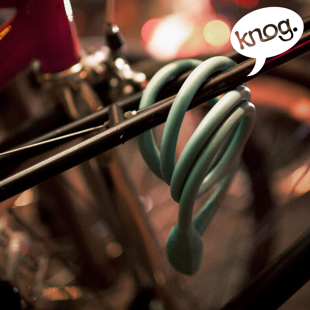 Knog Party Coil cable lock by ZEITBIKE, featuring a flexible coil design with a secure locking mechanism for bike security.