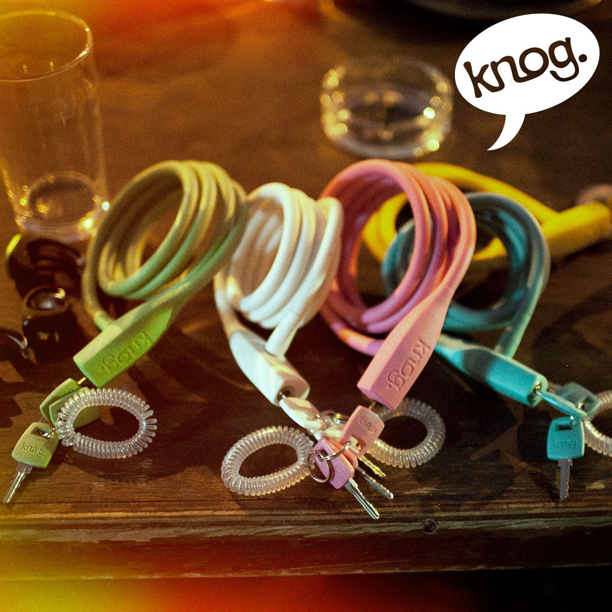 Knog Party Coil cable lock by ZEITBIKE, coiled lock with colorful design, ideal for securing bikes with flexible locking options.