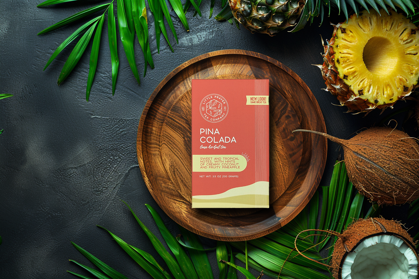 Herbal tea pouch labeled Pina Colada by Little Prayer Tea Company, featuring tropical-inspired packaging with herbs and flavor hints.