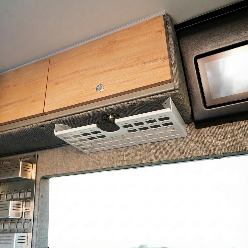 Driver side undercabinet shelf by Canyon Adventure Vans, made in Utah, with wooden finish and sturdy design for storage.