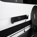 Canyon Adventure Vans magnetic ski and snowboard holder made in Utah, mounted on a vehicle roof rack for secure gear transport.
