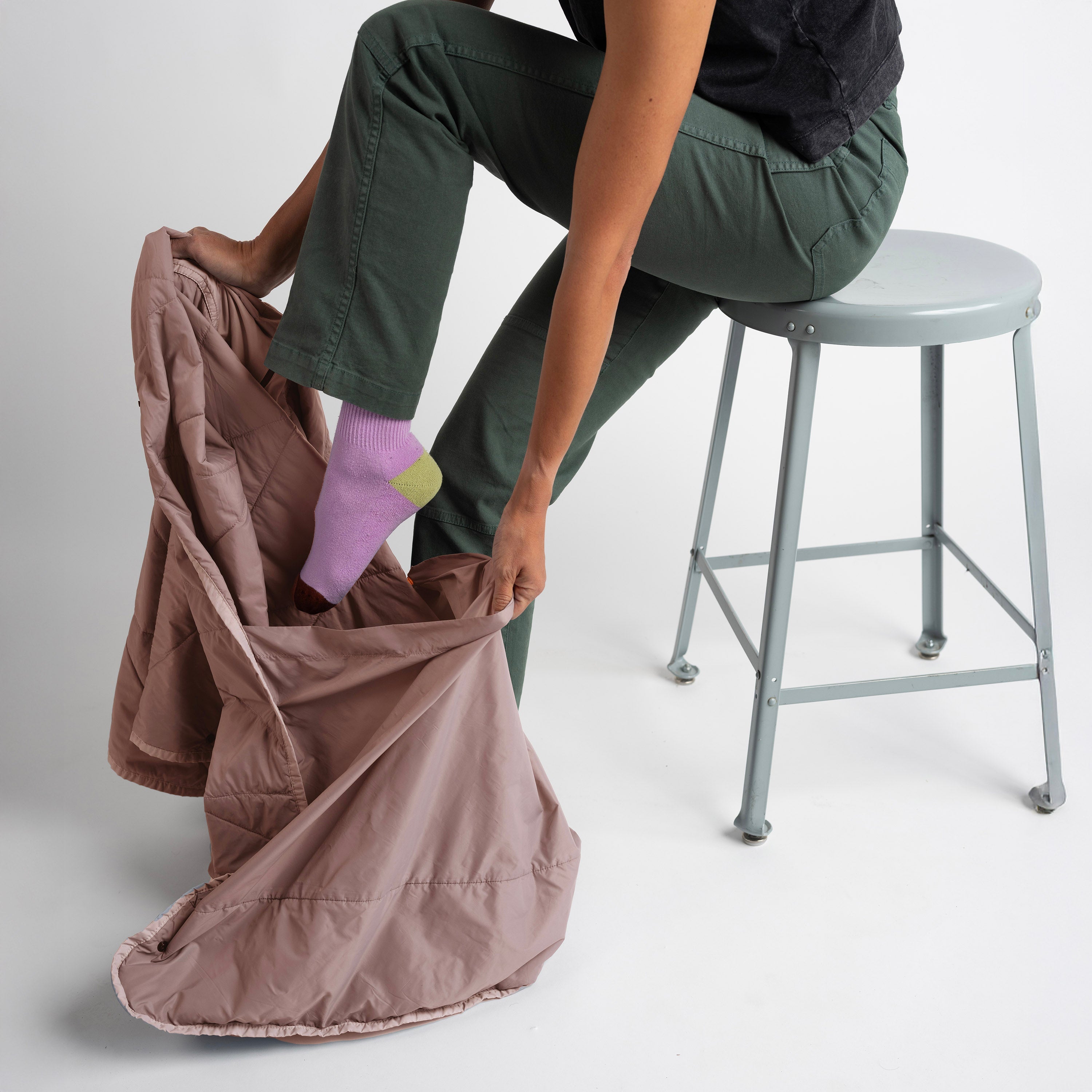 Gravel Layover™ travel blanket in quartz color, soft and cozy for on-the-go comfort with a smooth fabric finish.
