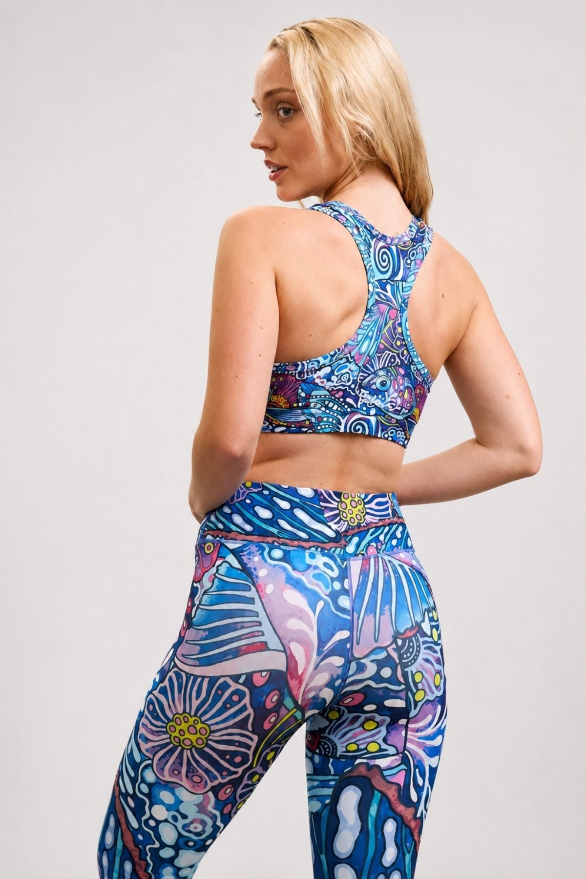 FisheWear Enchanted Grayling high-waisted leggings with colorful rainbow ridge pattern and a comfortable, stretchy fit.
