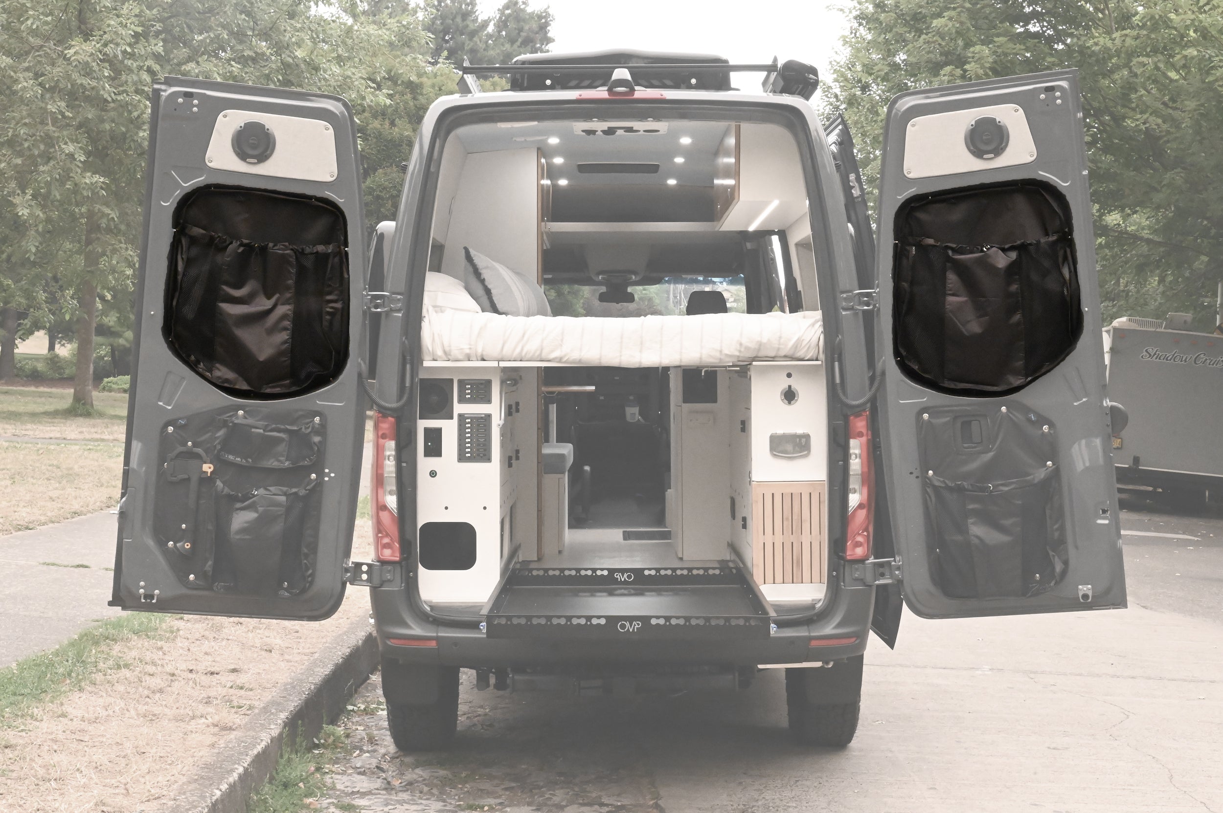 Alpine Van Works AVW Mid-Door Bags for storage, shown installed on a vehicle's rear mid-door for organized cargo space.
