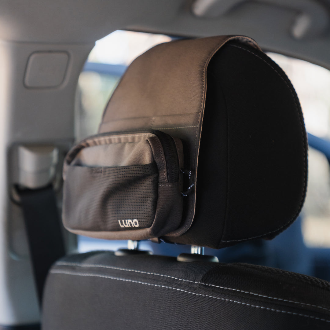 Luno® headrest organizer with multiple pockets for storage, designed for a clutter-free car interior.