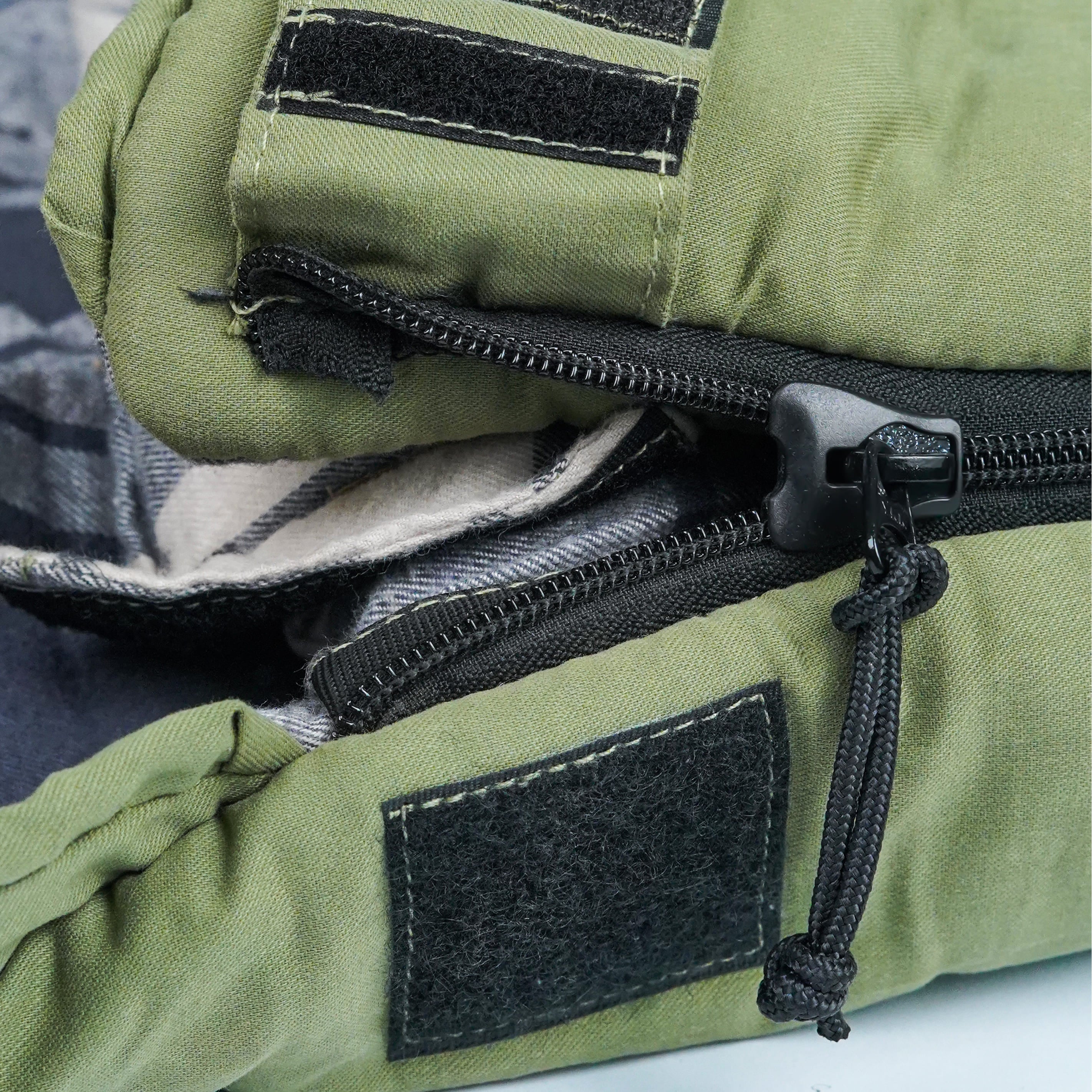 White Duck Outdoors Slumbernest™ 30°F sleeping bag spread open, showing its insulated interior and durable exterior fabric.