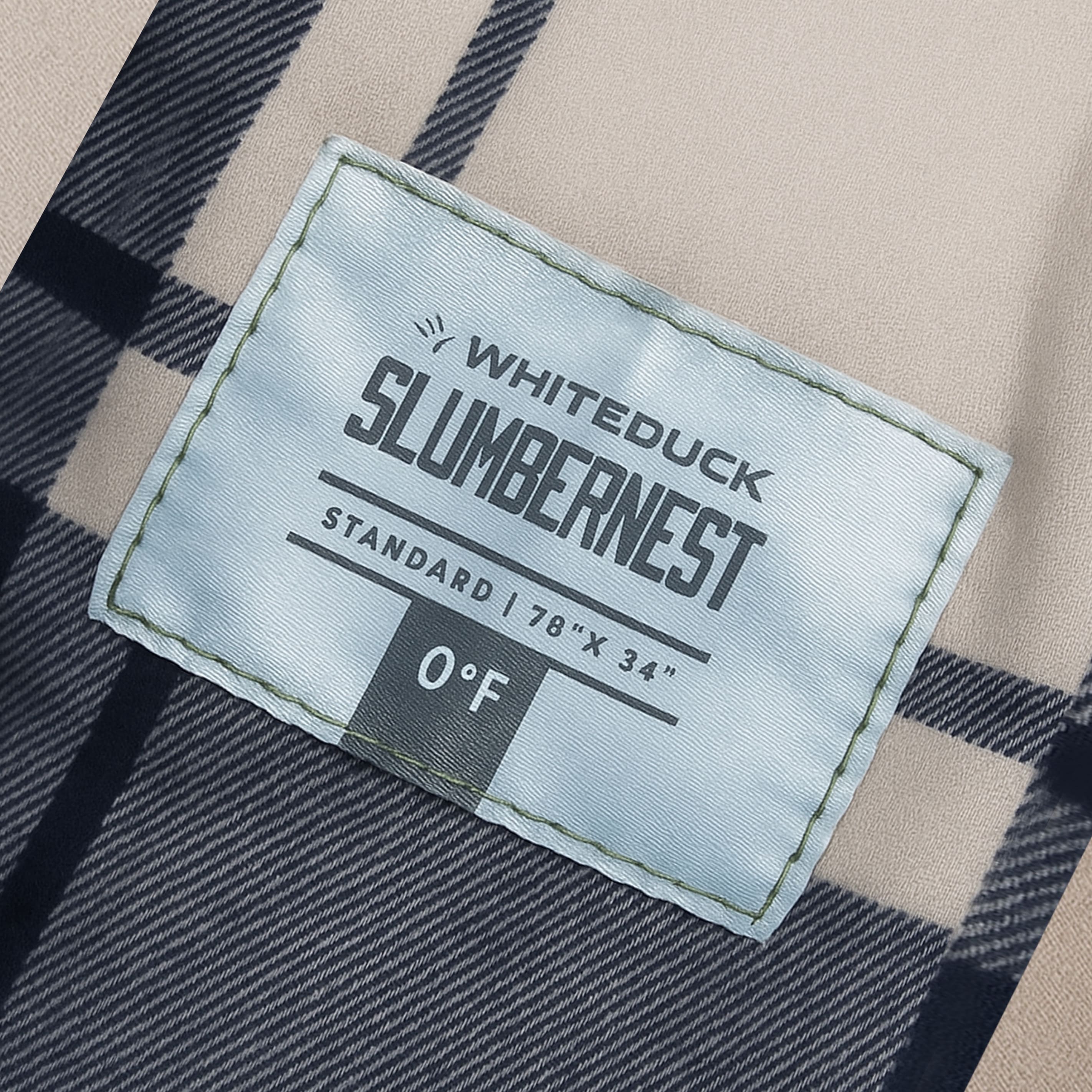 White Duck Outdoors Slumbernest™ sleeping bag rated for 50°F, shown open with insulated interior and durable water-resistant shell.