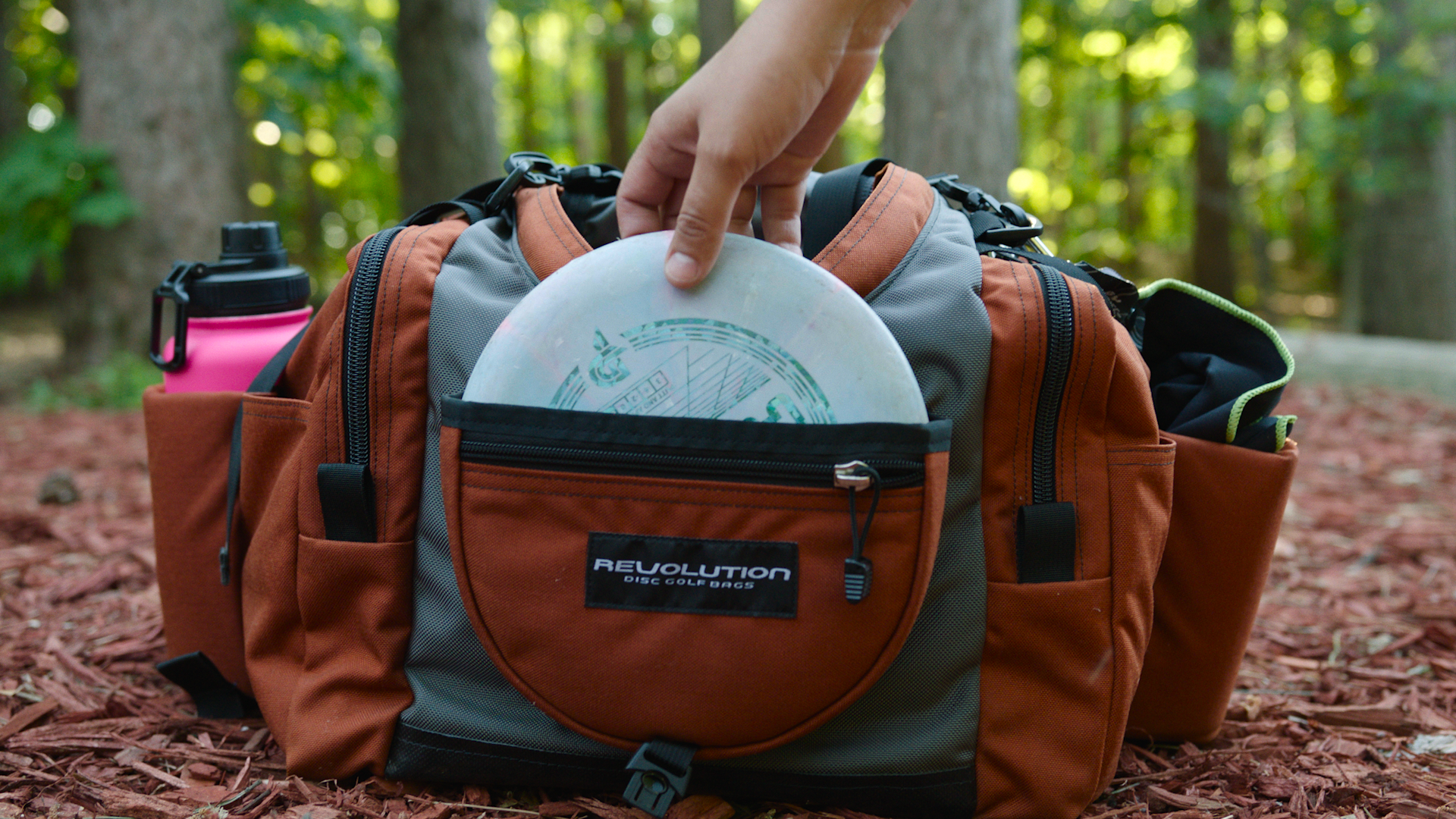 Gotta Go Gotta Throw Revolution Carolina Team V3 Disc Golf Bag in sapphire blue with multiple compartments and disc slots.
