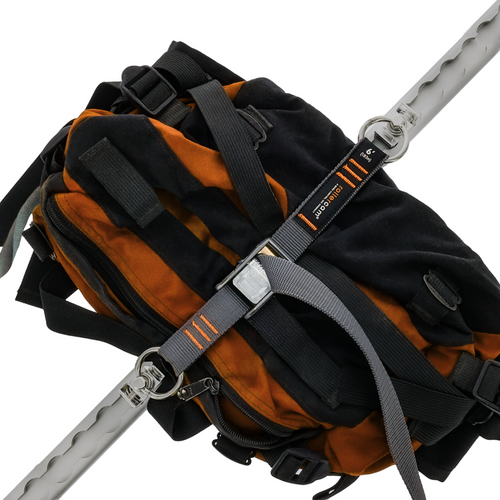 Rollercam L Track kit with truck bed tie-down straps and carrying bag for secure cargo anchoring and transportation.