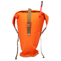 Bright orange waterproof backpacking dry bag with tan straps and buckle closure, featuring an integrated red hydration tube, shown on a plain white background.