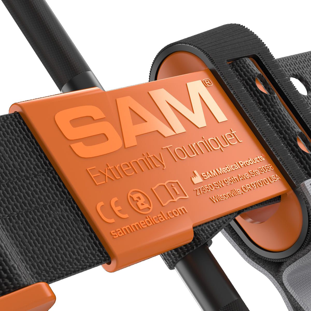 Black and orange SAM XT extremity tourniquet for bleeding management, designed by quakekits.com, shown in a close-up view.