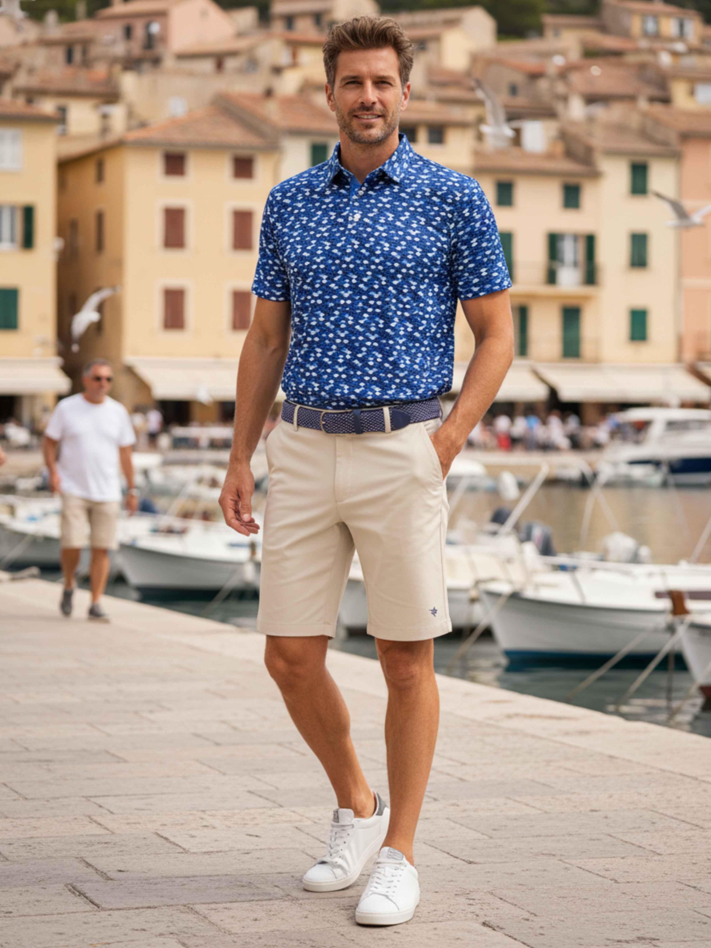 Tan Scales Polo by White Water Life displayed on a hanger, featuring a textured pattern and short sleeves.