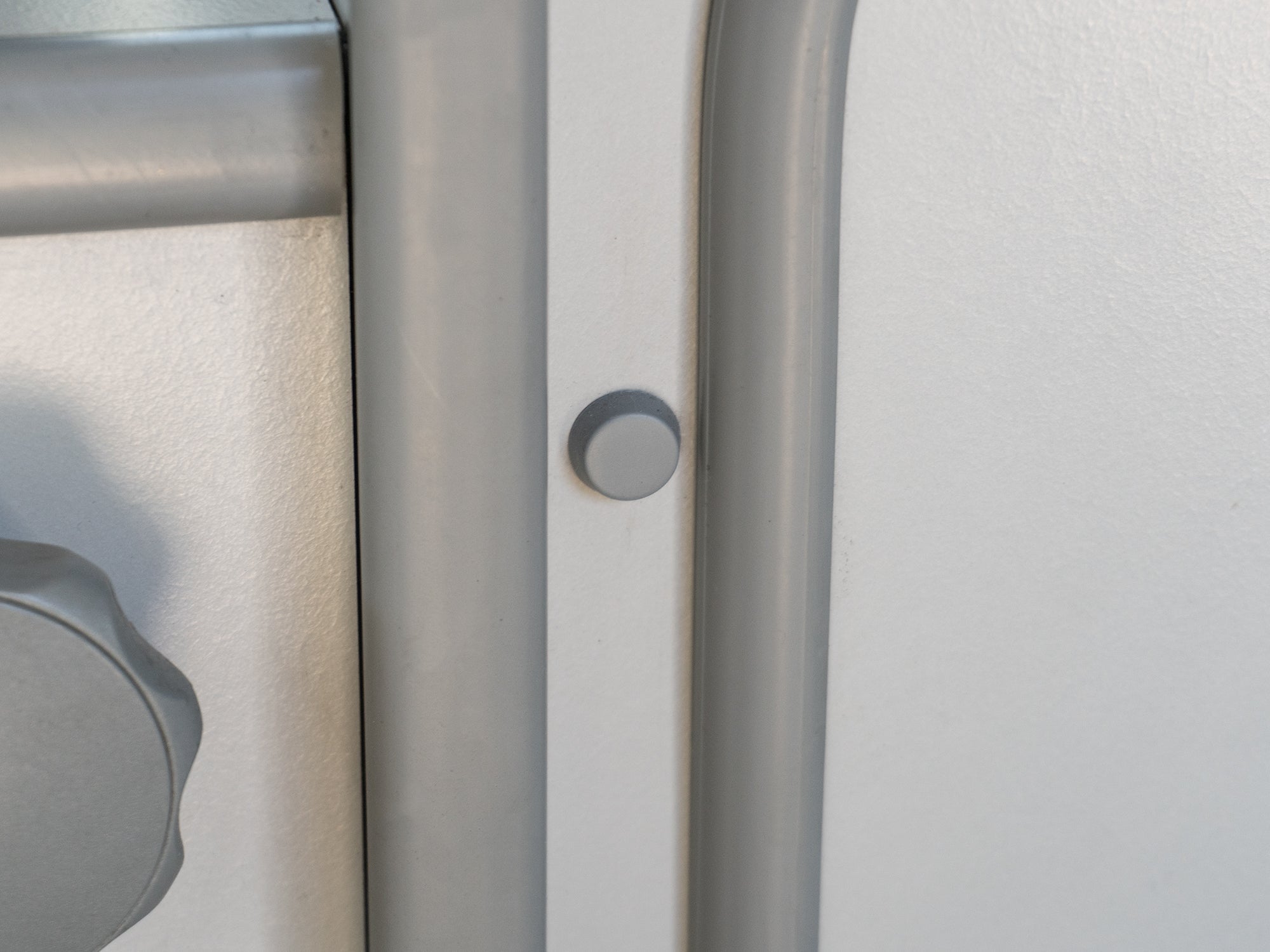 Set of five GoWesty interior screw caps for Vanagon, showing close-up of black plastic caps on vehicle interior components.