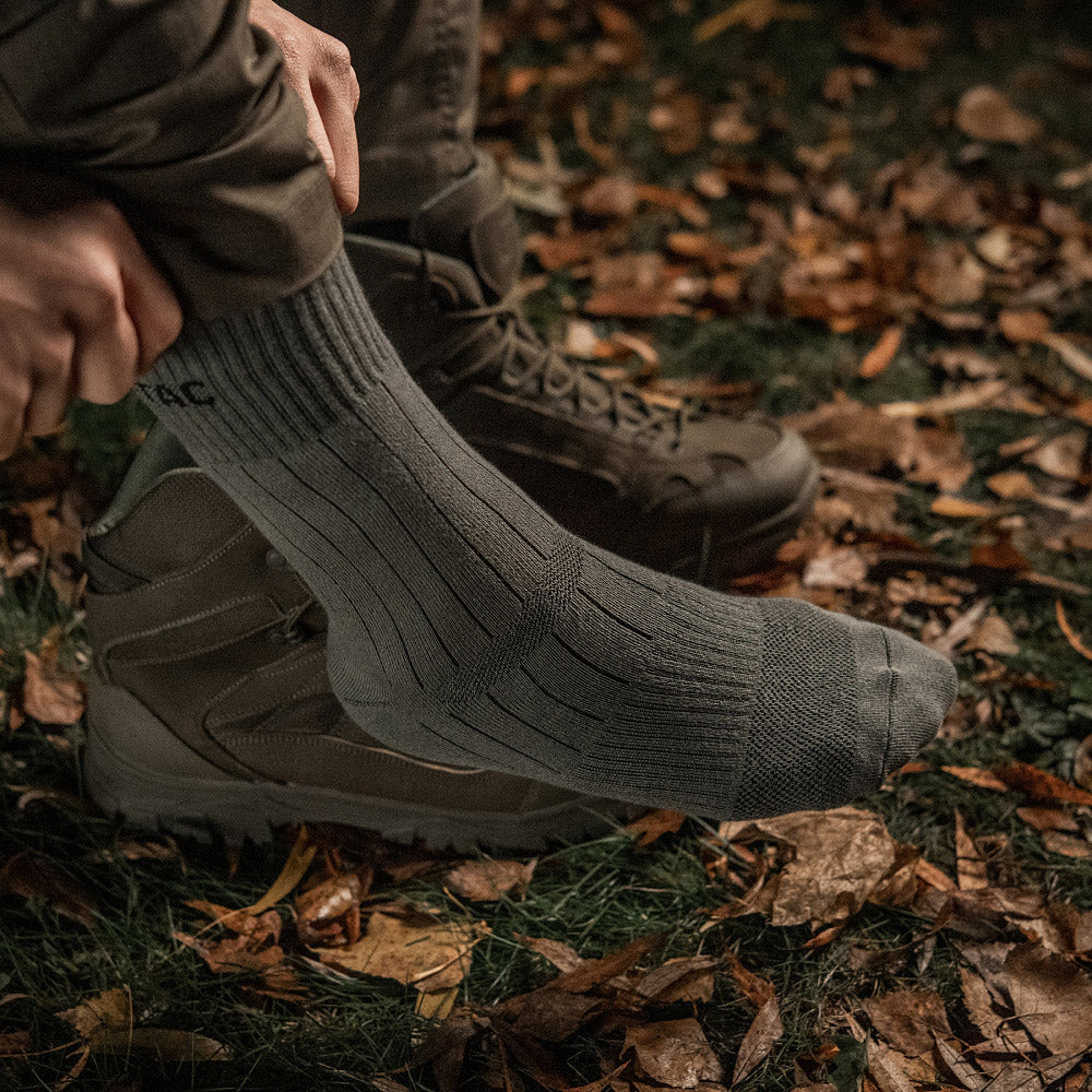 M-Tac mid calf tactical army socks in dark color, featuring reinforced heel and toe for durability and comfort.