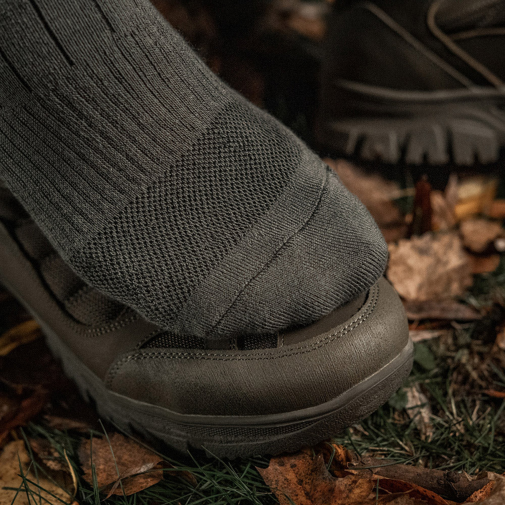 M-Tac tactical army mid calf socks in a rugged design, showcasing durable fabric and reinforced heel and toe.