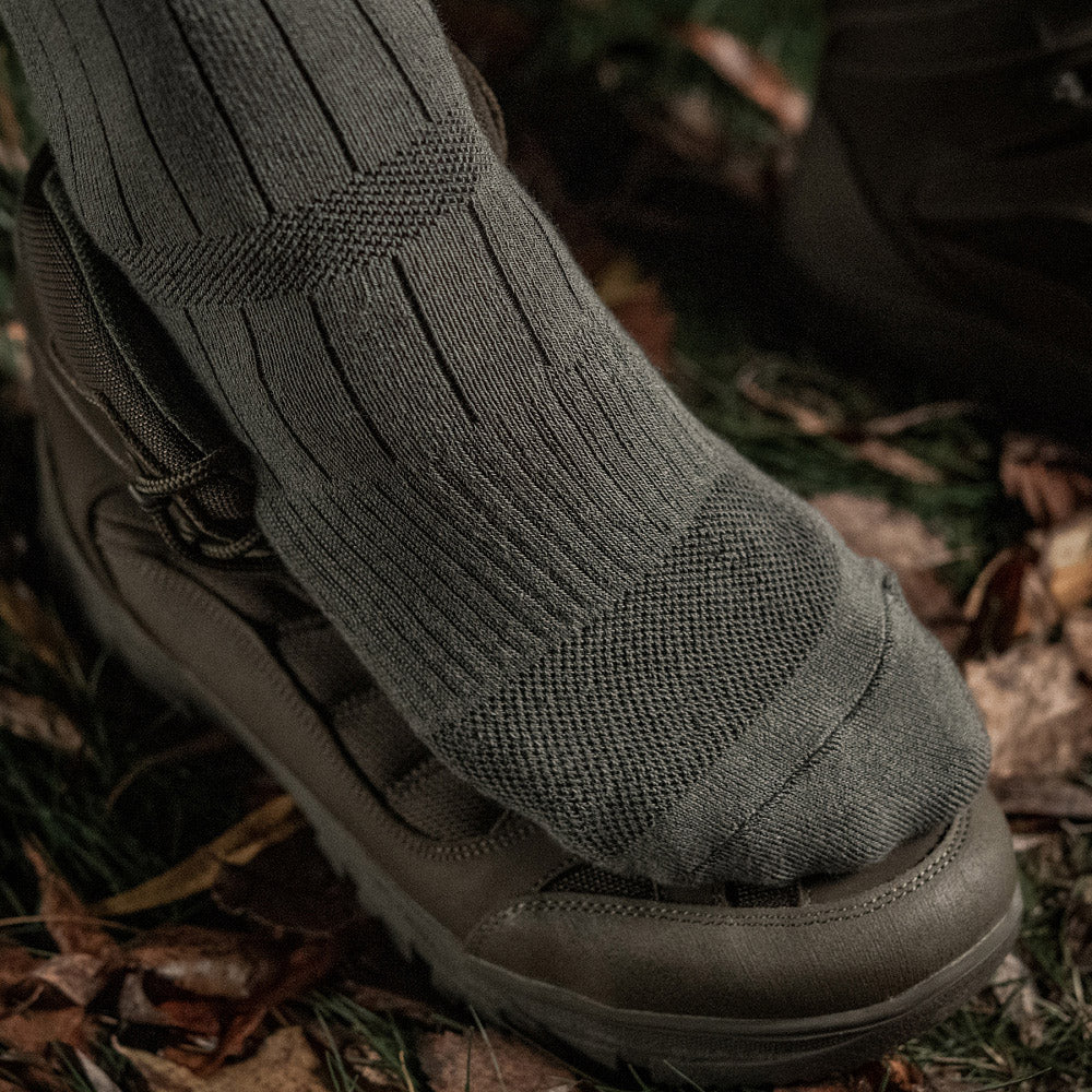M-Tac mid calf tactical army socks featuring durable fabric and reinforced support for outdoor activities.