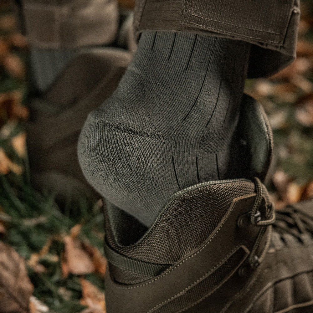 M-Tac tactical army mid calf socks in olive green, featuring reinforced toe and heel for durability and comfort.