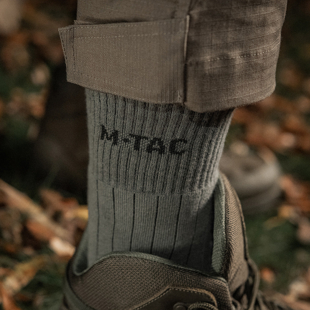 M-Tac mid calf tactical army socks in dark color, featuring reinforced toe and heel for durability.