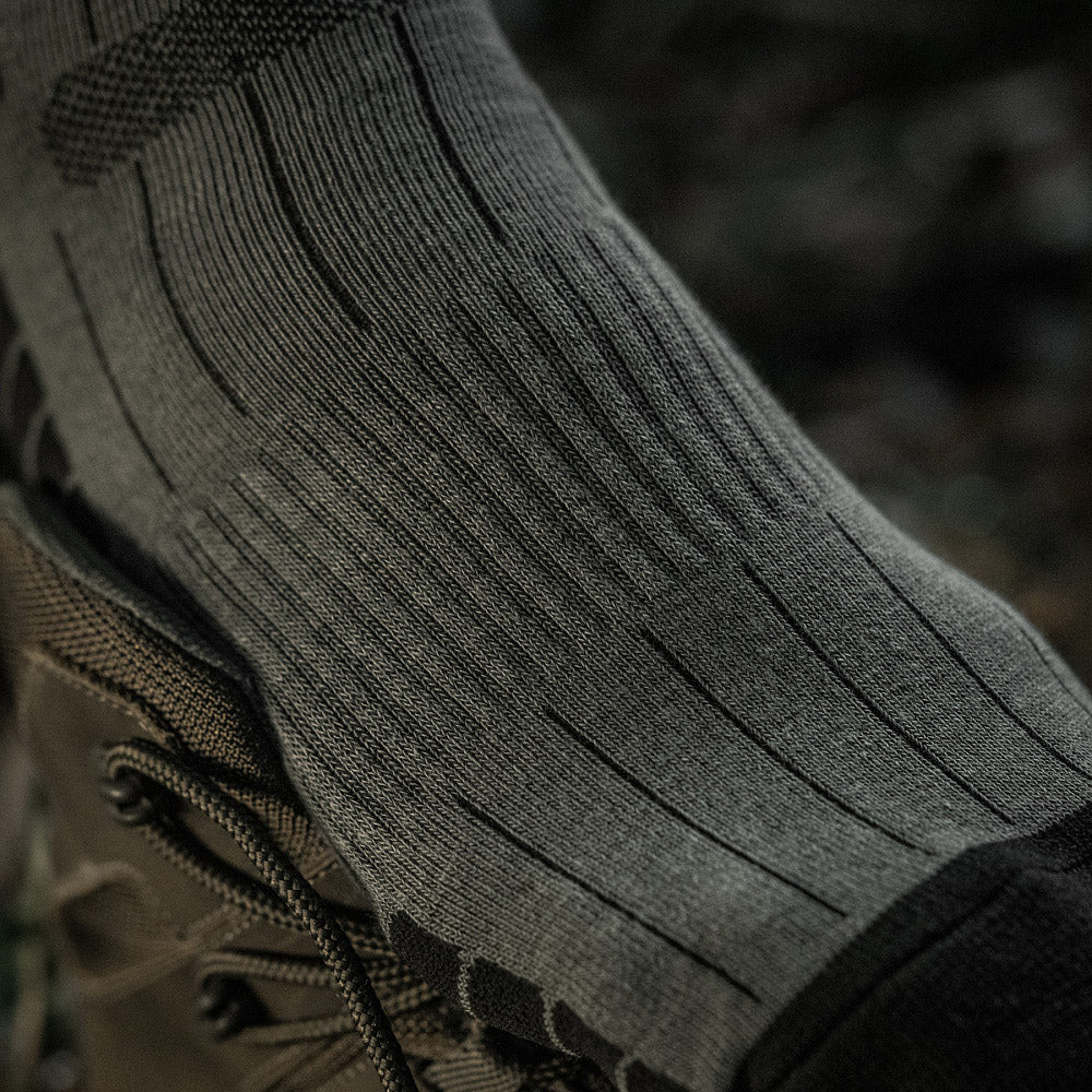M-Tac Tactical Ranger mid calf socks in a rugged design, featuring durable fabric and reinforced areas for outdoor activities.