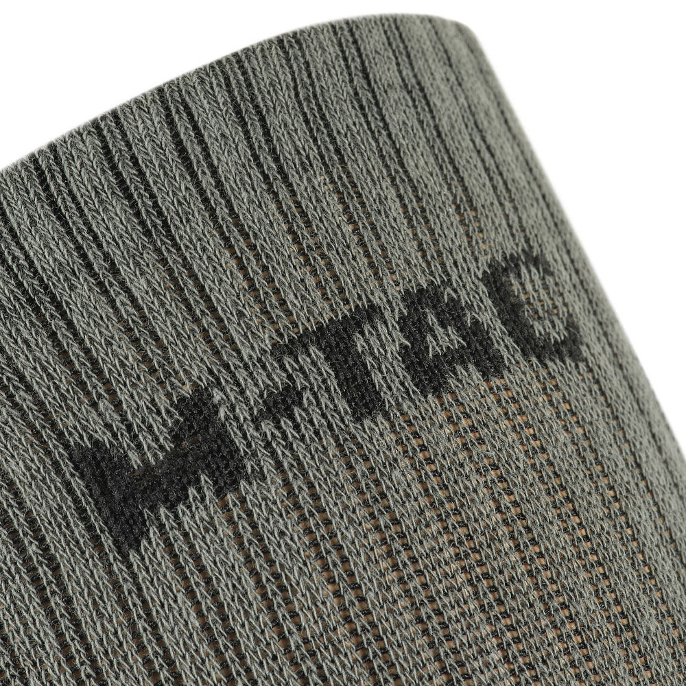 M-Tac Tactical Ranger mid calf socks in olive green, showcasing durable fabric and reinforced toe for outdoor activities.