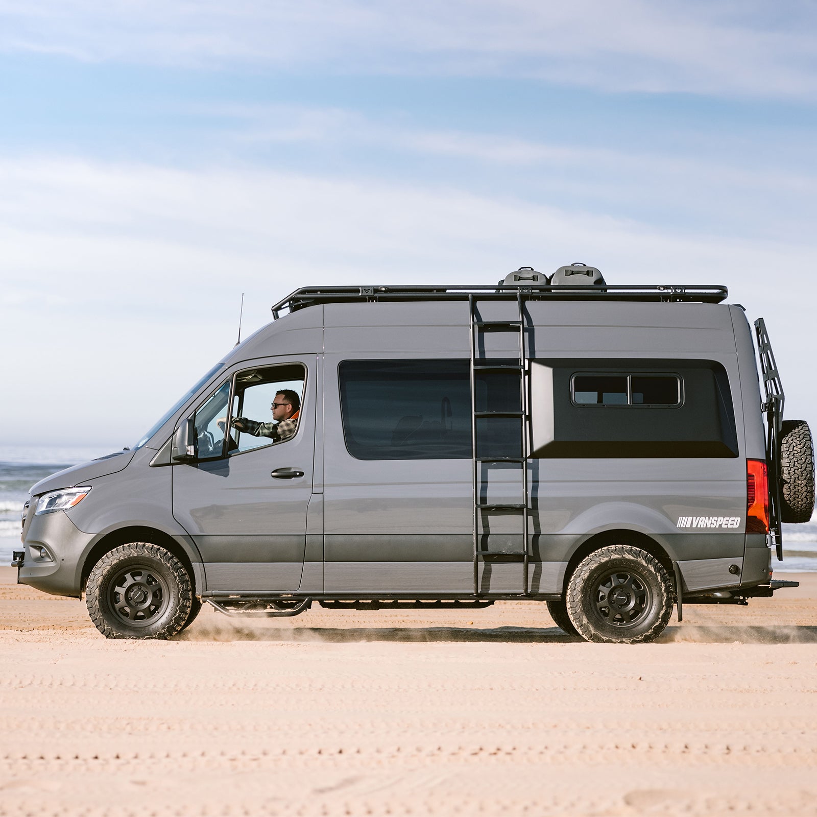 Vanspeed Sprinter side ladder by The Van Mart mounted on a van exterior for easy roof access.