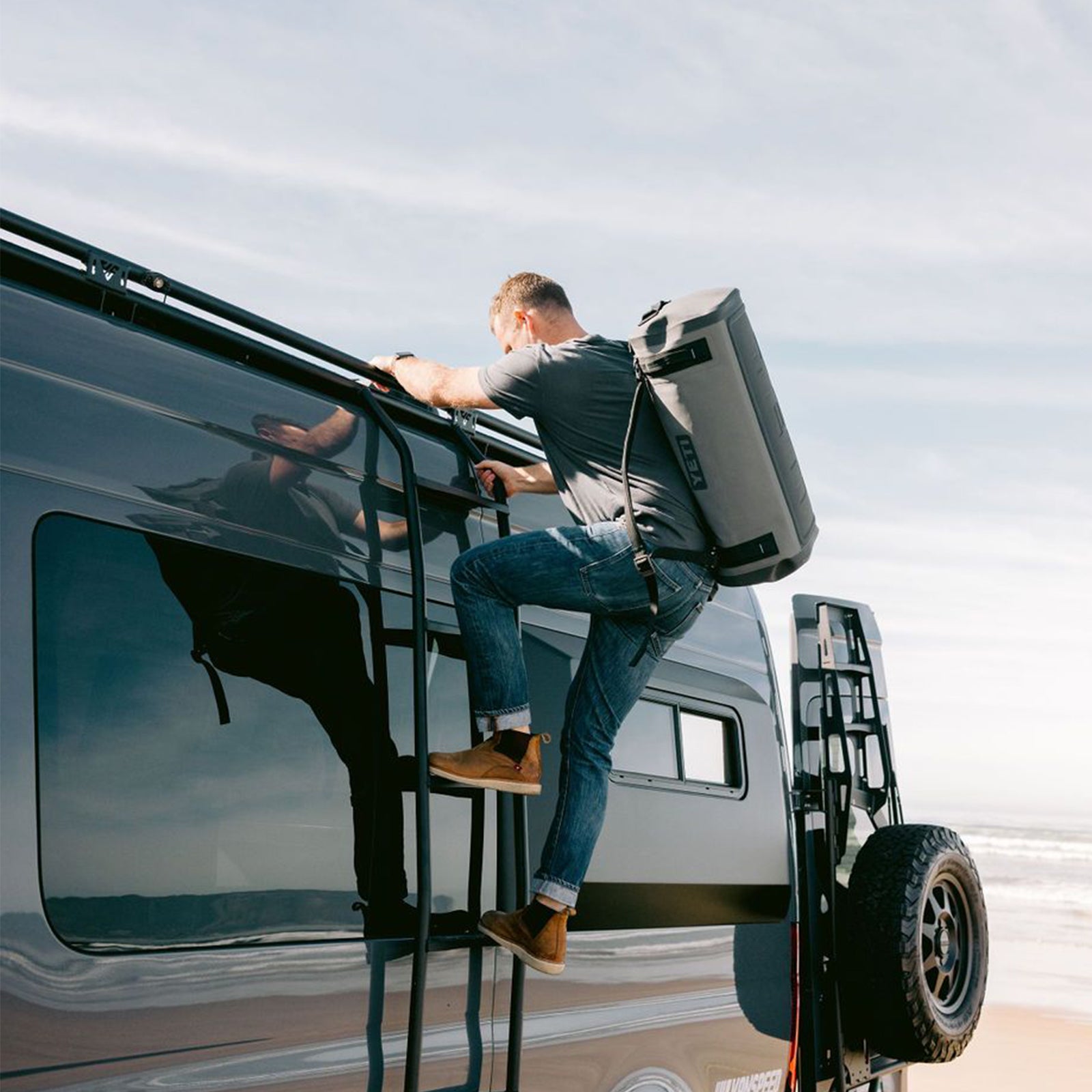 Vanspeed Sprinter side ladder installed on a van, exterior accessory from The Van Mart for easy roof access.