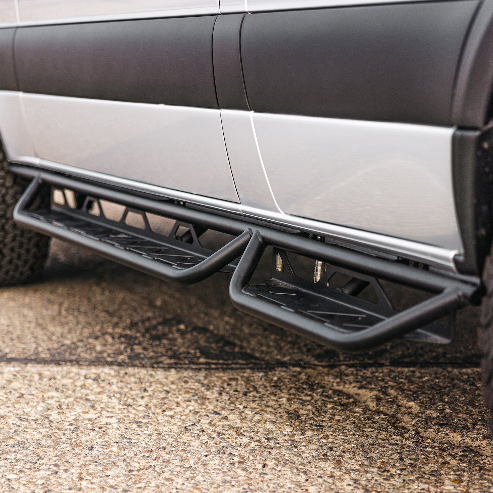 Vanspeed Sprinter side steps featuring a durable design, installed on a van for easy access.