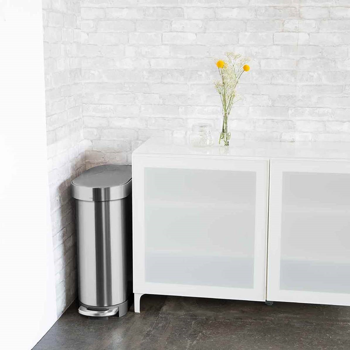 Stainless steel 12-gallon narrow kitchen trash can with step-on lid by HomePacific, featuring a sleek design and easy foot access.