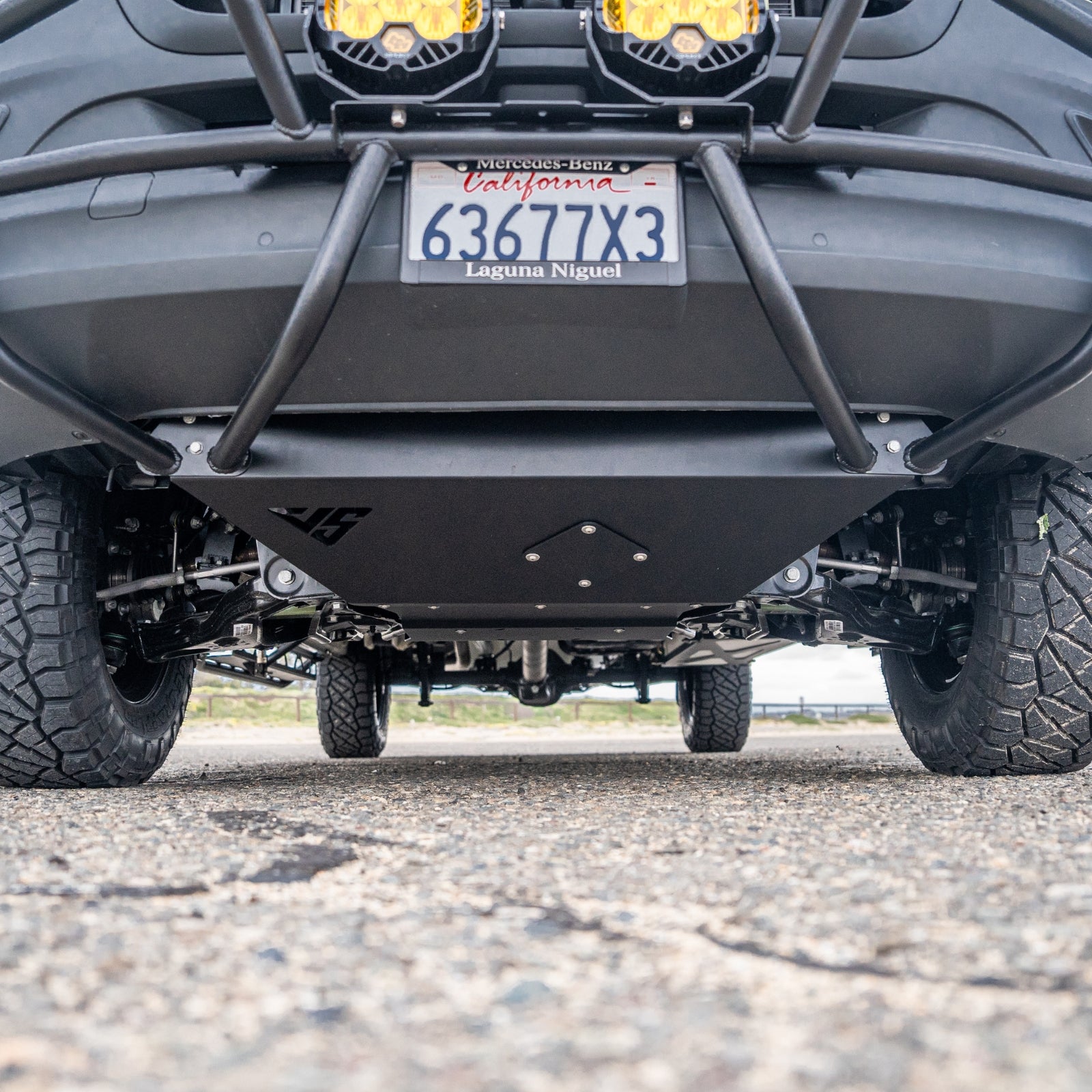 Sprinter skid plate from The Van Mart's VanSpeed DIY Collection, showcasing durable metal design for undercarriage protection.