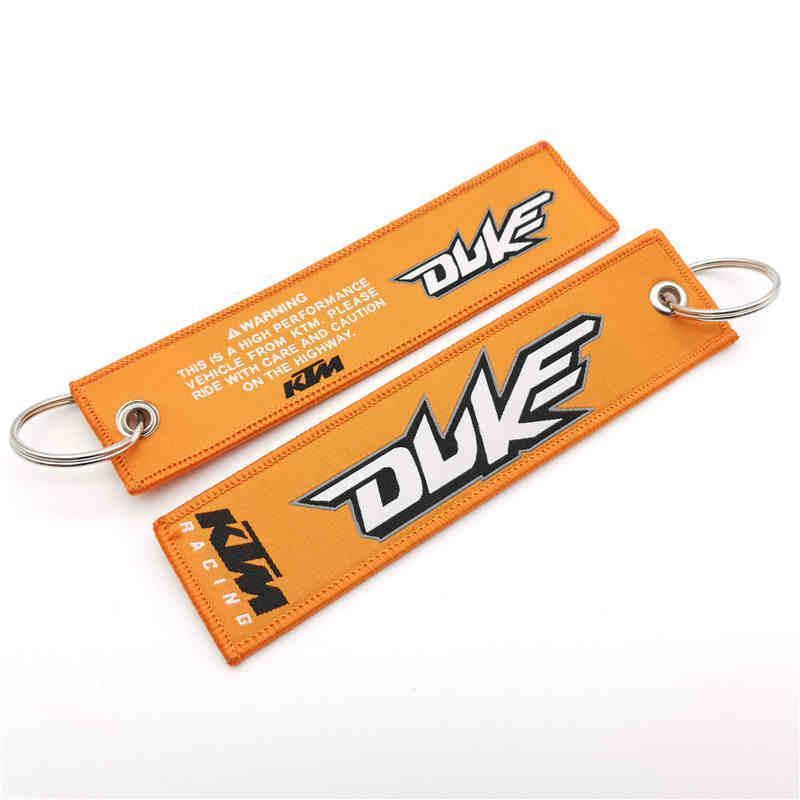 Embossed motorcycle brand embroidered keychain decor with detailed stitching, featuring the Bean's Moto Booth logo on fabric.