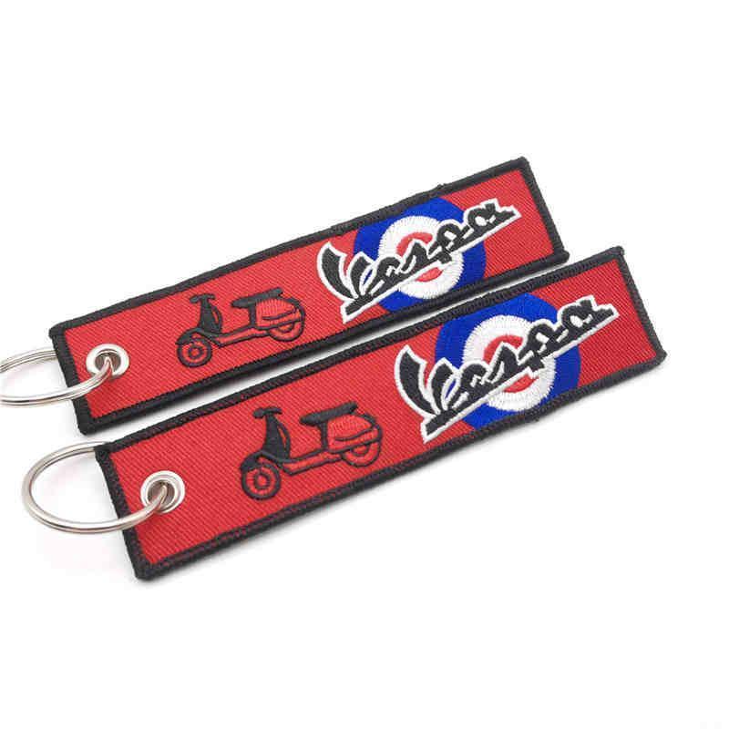 Embossed motorcycle brand embroidered keychain from Bean's Moto Booth, featuring detailed stitching and vibrant design.