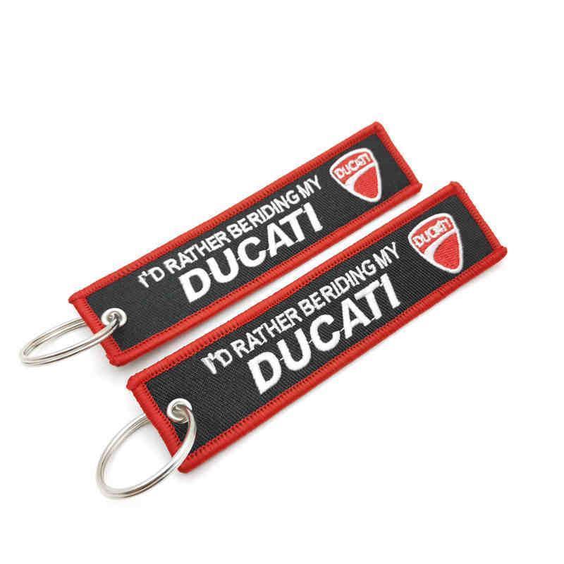 Embroidered motorcycle brand keychain with decorative design from Bean's Moto Booth, perfect for motorcycle enthusiasts.