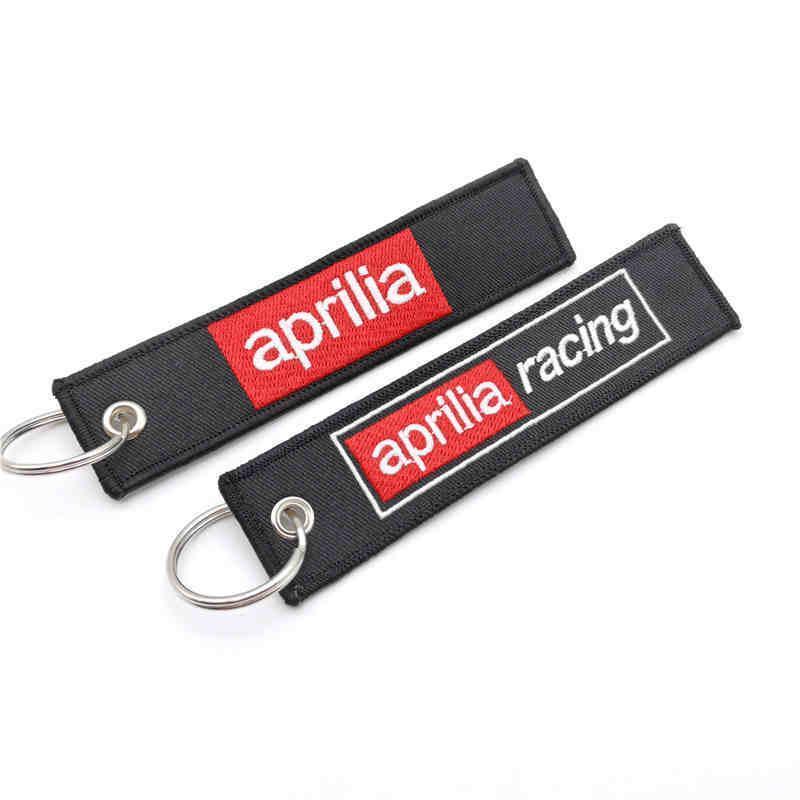 Embroidered motorcycle keychain decor featuring Bean's Moto Booth logo, with detailed stitching and vibrant colors.