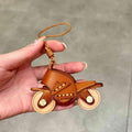Handcrafted genuine leather motorcycle pendant decor by Bean's Moto Booth, featuring detailed leather craftsmanship and moto-inspired design.