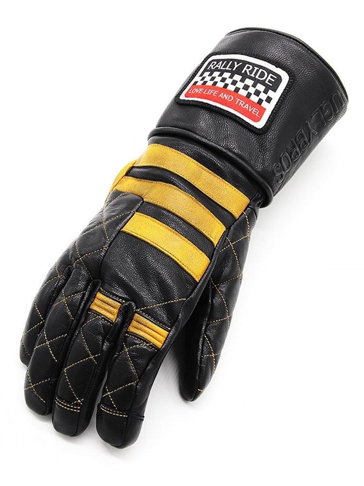 Vintage winter motorcycle riding gloves by UGLYBROS™ with leather and fleece lining, shown on a rider's hands.