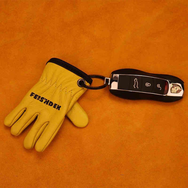 Vintage handcrafted leather motorcycle glove keychain with decorative design by Bean's Moto Booth for motorcycle enthusiasts.