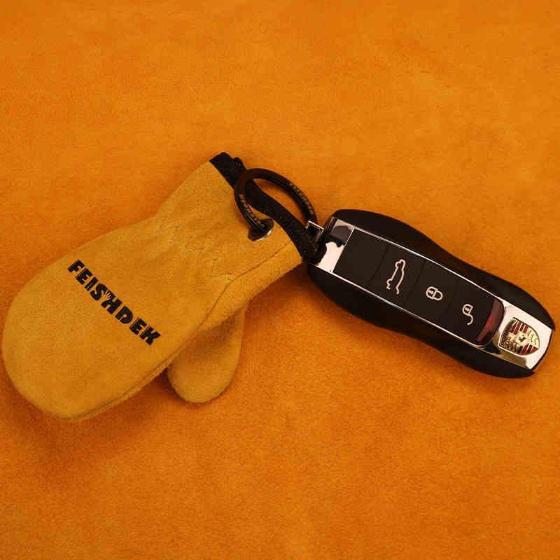 Vintage handcrafted leather motorcycle glove keychain featuring detailed stitching and rustic design, ideal as motorcycle decor accessory.