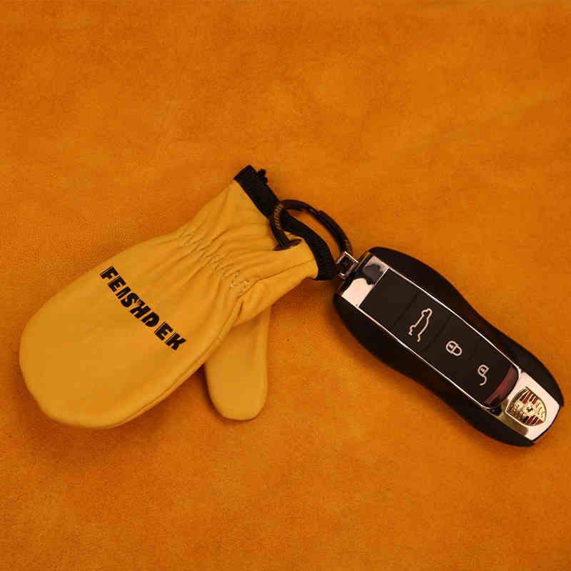 Vintage handcrafted leather motorcycle glove keychain with detailed stitching and rustic finish, designed for motorcycle decor enthusiasts.