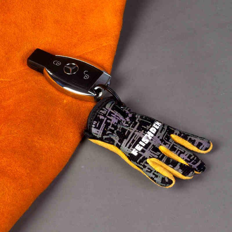 Vintage handcrafted leather motorcycle glove keychain with decorative details, featuring rustic leather and metal accents.