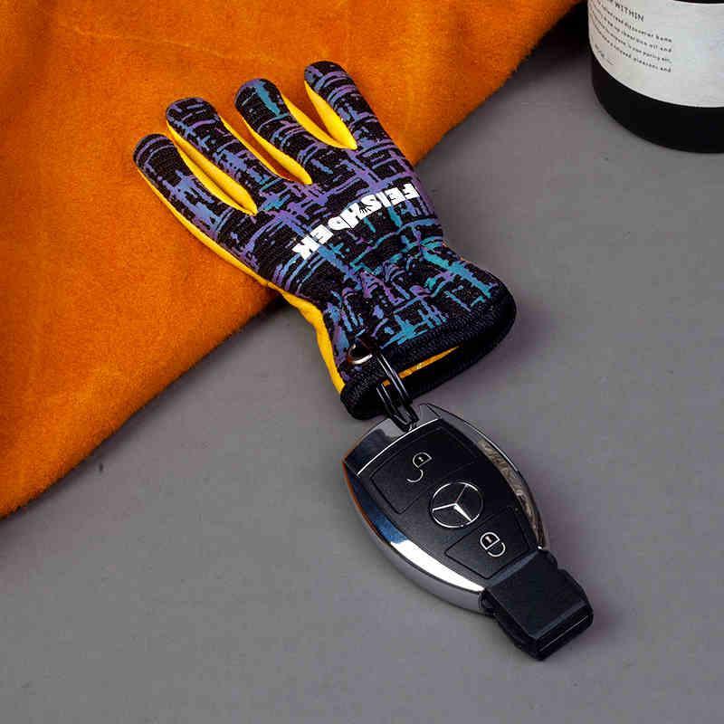 Vintage handcrafted leather motorcycle glove keychain with detailed stitching, designed for motorcycle enthusiasts and decor.