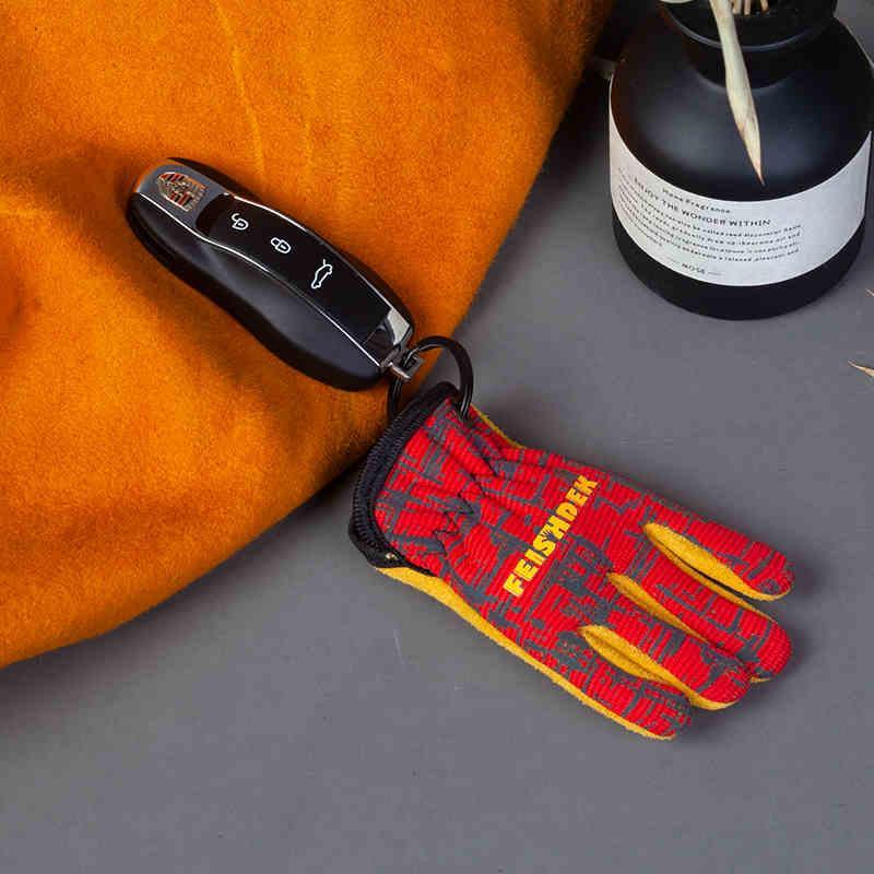 Vintage handcrafted leather motorcycle glove keychain from FEISHDEK™ with detailed leather stitching and rustic finish.