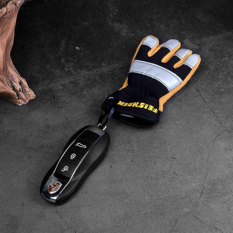 Vintage handcrafted leather motorcycle glove keychain from FEISHDEK™ featuring detailed leather design and metal keyring decor.