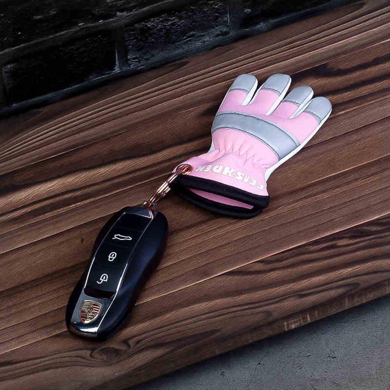 Vintage handcrafted leather motorcycle glove keychain decor featuring detailed stitching and rustic leather from Bean's Moto Booth.