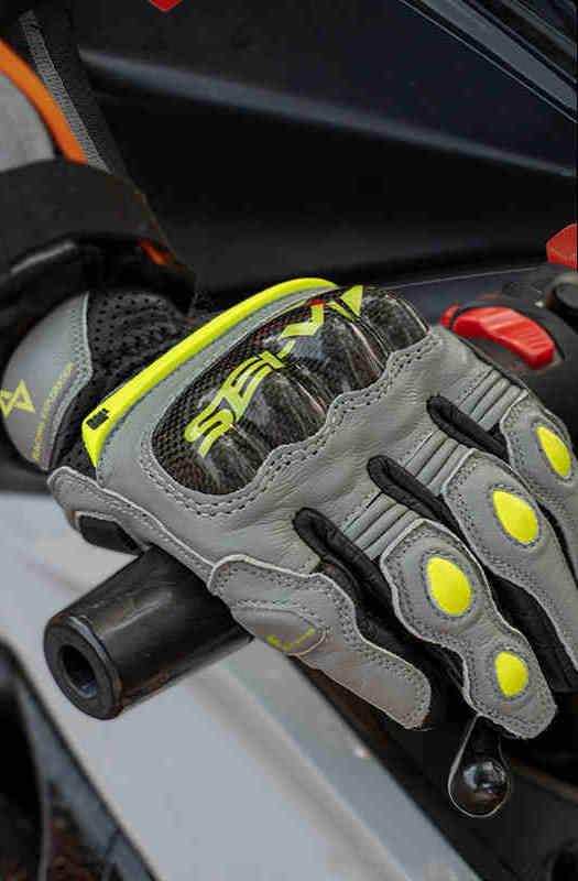 Seivi™ motorcycle carbon fiber leather gloves with reinforced palms and adjustable straps, designed for motorcycle riding.